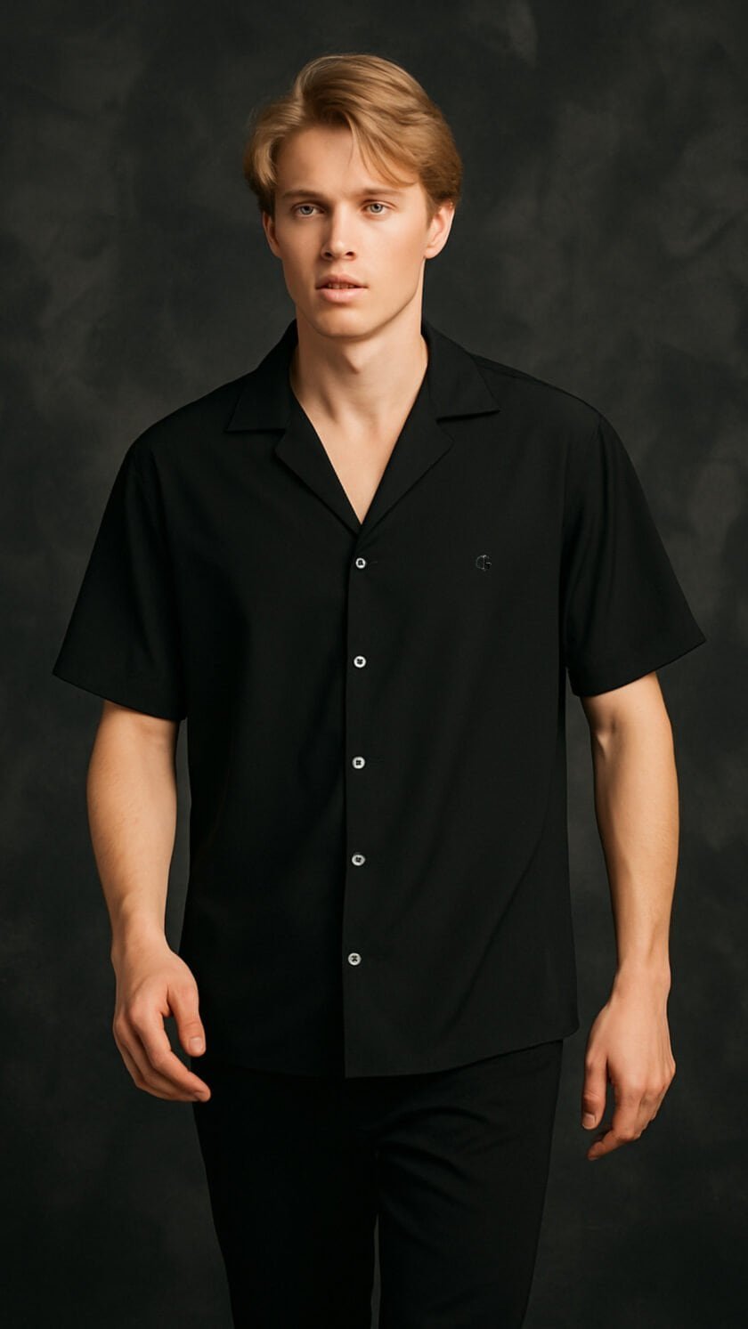 Crispy black short-sleeve button-up shirt for men, modern casual style, stylish men's fashion piece, versatile black shirt for everyday wear.