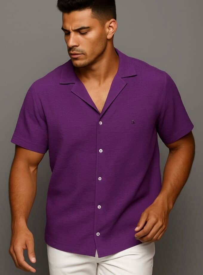 Purple casual men's short-sleeve shirt with notched collar, front buttons, and small embroidered logo, perfect for stylish summer or warm weather fashion.