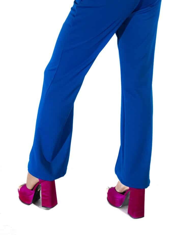 Pink velvet high heel shoes paired with bright blue wide-leg trousers, showcasing fashionable and vibrant footwear options for women. Perfect for style-conscious individuals seeking bold accessories.